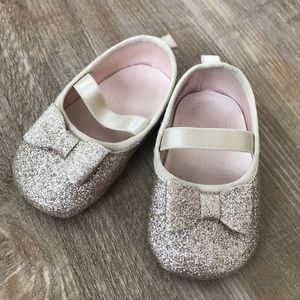A pair of infant shoes.